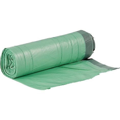 Groene vuilniszakken, opgerold, op een witte achtergrond. Donkergroene sluiting.