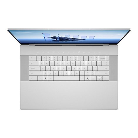 Hellgraues Laptop von oben mit geöffnetem Display. Tastatur, auf dem Display Schriftzug Dell Technologies.