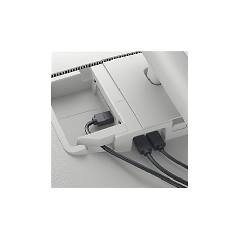 Gros plan de l'arrière d'un écran blanc avec des câbles connectés. On voit les ports, les câbles et une gestion intégrée des câbles.