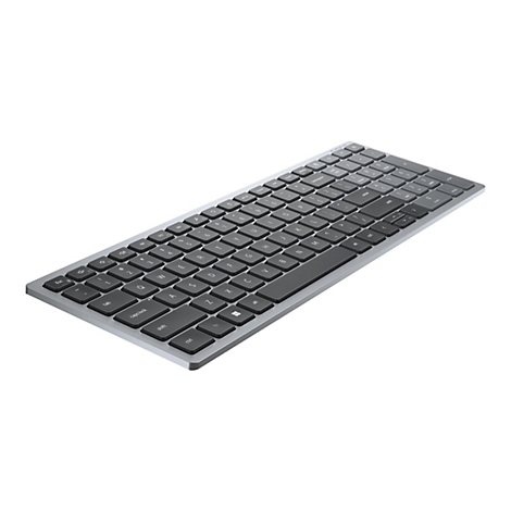 Draufsicht auf eine silberne Tastatur mit schwarzen Tasten. Die Tastatur liegt auf weißem Grund.