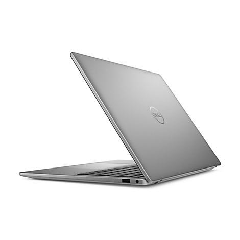 Ein silberner Laptop, teilweise geöffnet, wird schräg von hinten gezeigt. Der Deckel trägt das Dell-Logo.