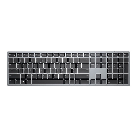 Vue de dessus d'un clavier argentÃ© avec des touches noires, isolÃ© sur fond blanc.