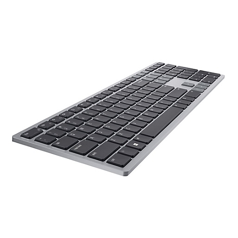 Draufsicht auf eine silberne Tastatur mit schwarzen Tasten. Die Tasten sind flach und rechteckig angeordnet.