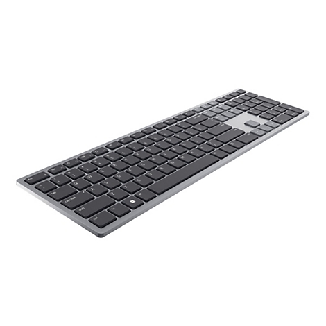Ein silberfarbenes Keyboard mit schwarzen Tasten liegt diagonal vor weißem Hintergrund.