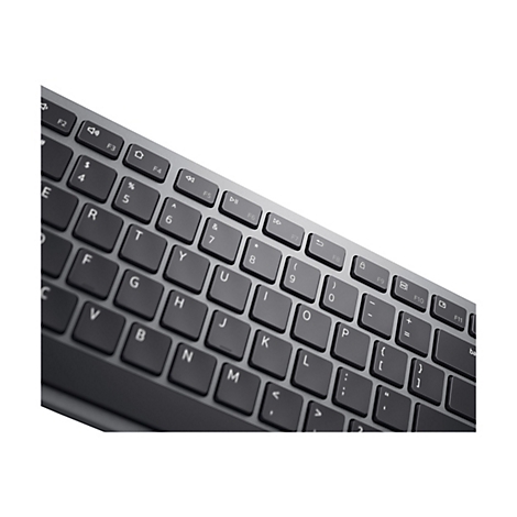 Nahaufnahme einer schwarzen Tastatur mit grauem Rahmen. Die Tasten sind beschriftet.