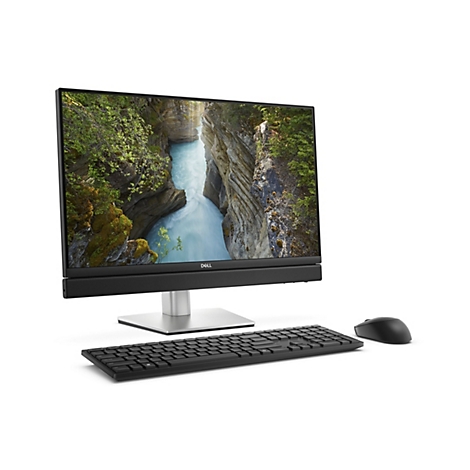 Un ordinateur tout-en-un Dell avec écran, clavier et souris. L'écran affiche un paysage avec une cascade.