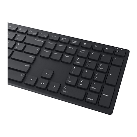 Nahaufnahme einer schwarzen Tastatur mit weißen Beschriftungen. Die Tasten sind rechteckig und in einem dunklen Grau gehalten.