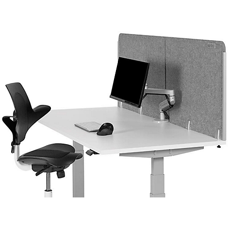 Desk with monitor, keyboard, mouse and chair in front of grey felt. The monitor is attached to a swivel arm.