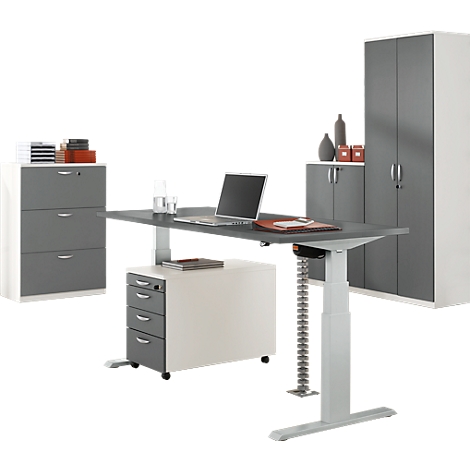Gray height-adjustable desk with drawer cabinet, filing cabinet, and laptop.