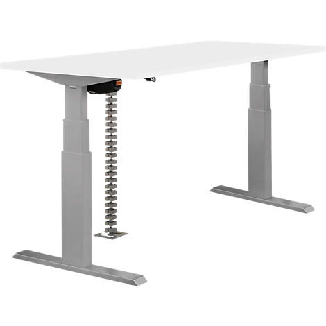 An adjustable height desk with a white tabletop and silver legs. The adjustment mechanism is visible.