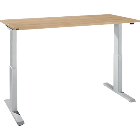 Light-colored, height-adjustable desk with a light brown tabletop and silver frame.