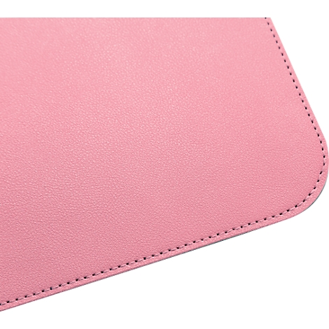 Close-up of a pink surface with black stitching on the edge.
