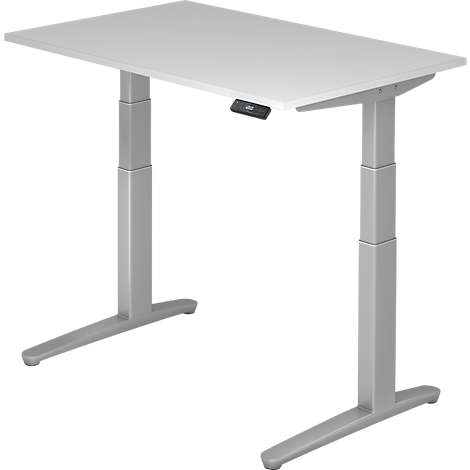 Grey adjustable height desk, photographed from the front. A control panel is visible on the table top.