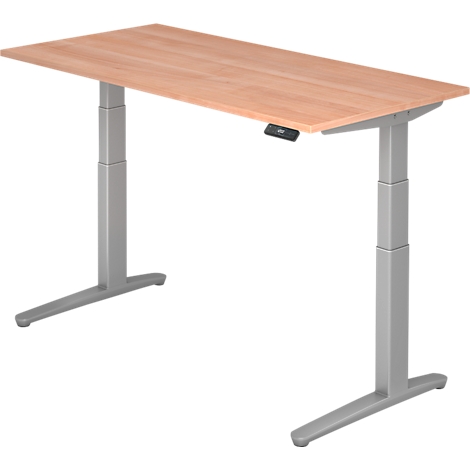 A height-adjustable desk with a wooden top and silver legs. It has a control panel.