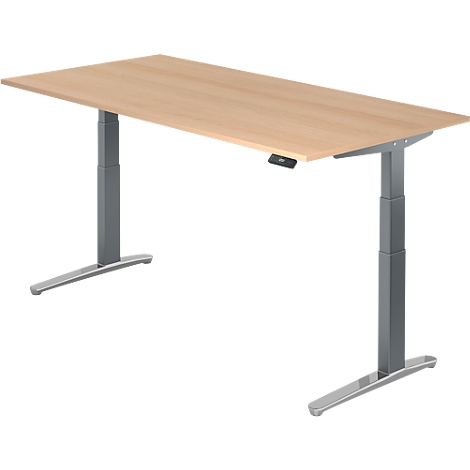 Height-adjustable desk with light wood top and gray legs. Features black control panel.