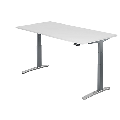 A white height-adjustable desk. Grey legs, control on the edge of the desk.