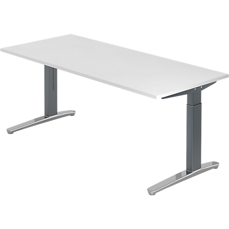 White rectangular desk with height-adjustable, grey feet. The desk stands against a white background.