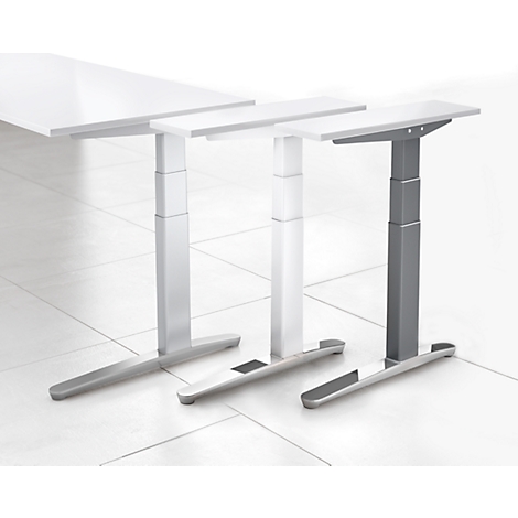 Three height-adjustable desks with different leg and tabletop colors, against a light background.