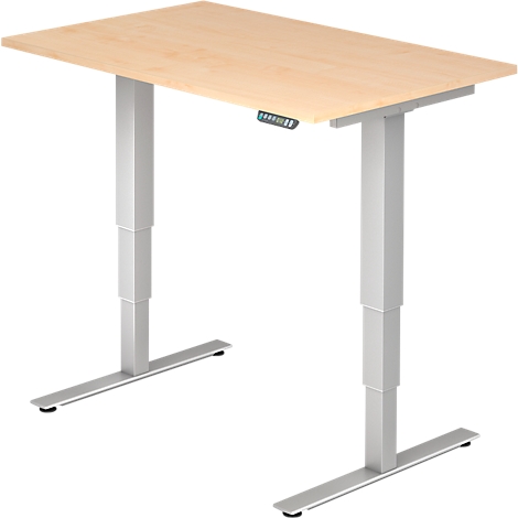A height-adjustable desk with a light wood top and silver legs. There is a control panel on the tabletop.