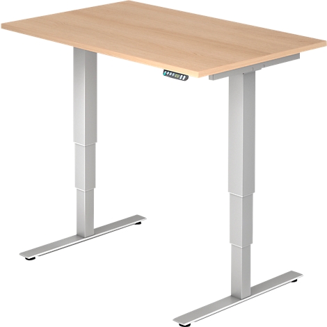 A height-adjustable desk with a light brown tabletop and silver legs that can be adjusted at the touch of a button.