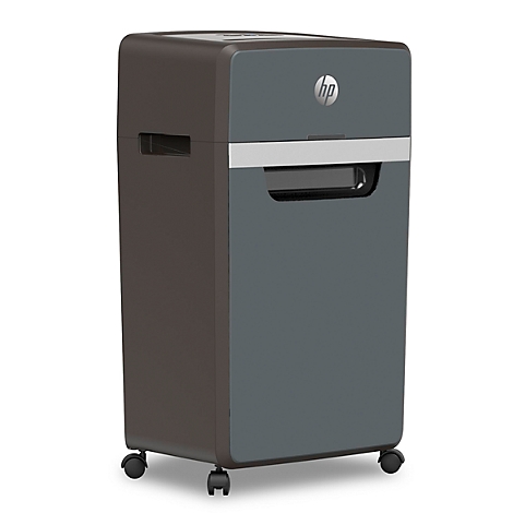 Déchiqueteuse de papier gris-brun avec logo HP, sur roulettes.