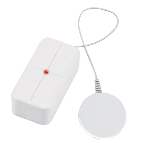 Appareil rectangulaire blanc avec une fixation ronde, relié par un câble. Une lumière rouge est allumée.