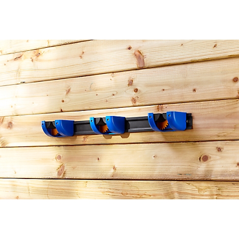 Blue tool holder mounted on a wooden slat wall.
