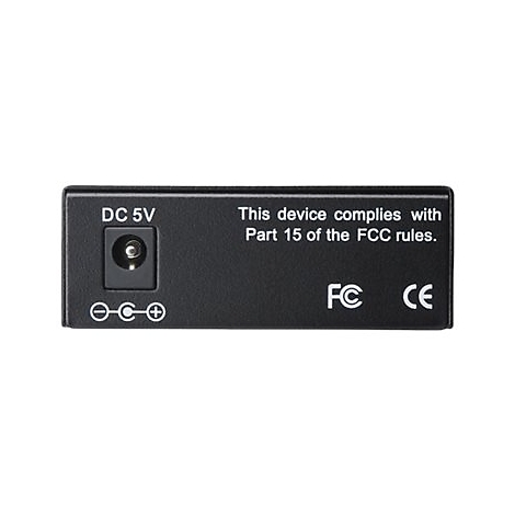 Schwarzes Elektronikgerät mit DC 5V Anschluss. Text: "This device complies with Part 15 of the FCC rules."