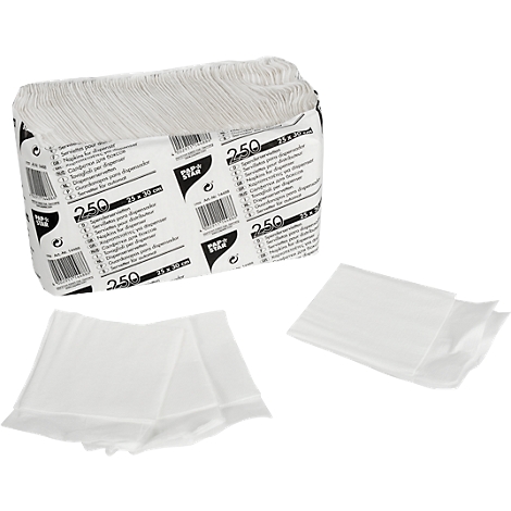 A pack of paper napkins and loose napkins. The packaging is white, printed with text and barcodes. The napkins are white.