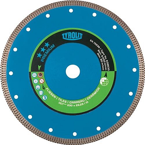 Disque de coupe bleu circulaire avec marquages blancs et dents sur le bord. Inscription : Tyrolit, Premium, Carreaux, Carrereau, Ceramica.