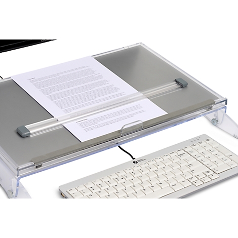 Transparante documenthouder met papier, toetsenbord en monitor op de achtergrond.