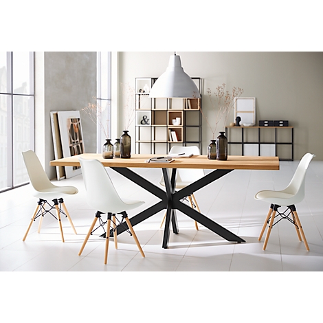 Wooden dining table with white chairs. Black metal frame and pendant lamp.