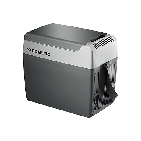 Graue, kompakte Dometic-Kühlbox mit Tragegurt vor weißem Hintergrund.
