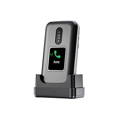 Graues Telefon auf Ladestation. Auf dem Bildschirm: Grüner Telefonhörer, Text "Anne".