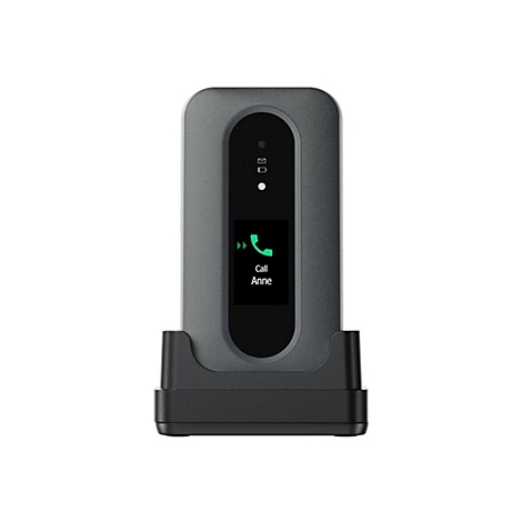 Base de téléphone fixe grise dans une station de charge, appelant Anne. Écran éclairé en vert avec une icône de téléphone.