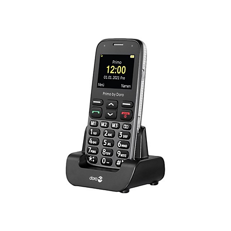 Mobiltelefon, stehend in einer Ladestation. Das Display zeigt die Uhrzeit und das Datum an. Unterhalb der Tastatur sind groÃŸe Tasten angeordnet.