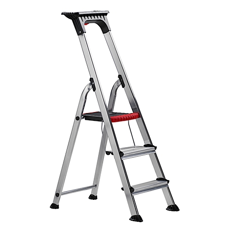 Metal ladder, silver colored. Red accents. With two steps, a platform and a handle.