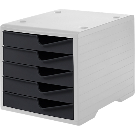 White storage system with four dark drawers. There are four round elevations on the top.