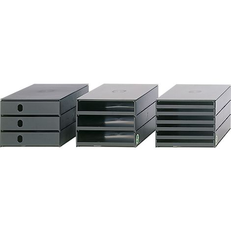 Three grey office desk trays in different designs. One with drawers, the others with open compartments.