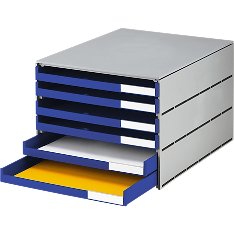 Gray, rectangular drawer cabinet with blue drawers. Two drawers are open, one with yellow paper, one with white paper.