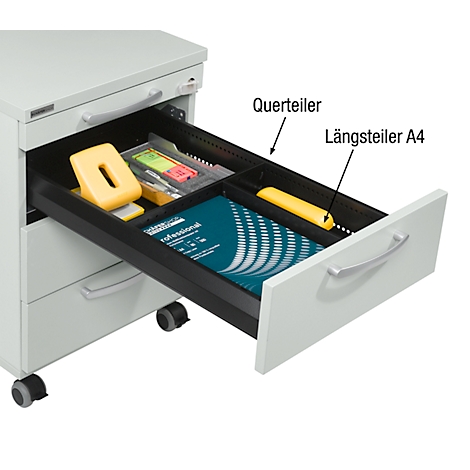Drawer cabinet, drawer open. Perforated dividers, work materials and paper visible in the drawer.