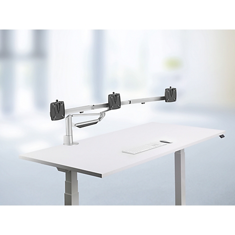 Bureau met monitorbevestiging. De monitorbevestiging kan aan de rand van het bureau worden bevestigd en houdt twee monitoren vast.