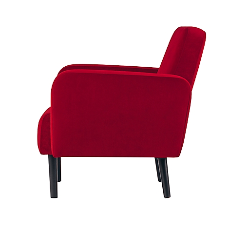 Rode fauteuil in profiel. Zwarte poten, zachte randen, fluwelen oppervlak.