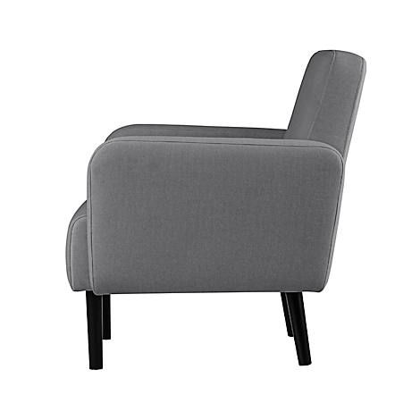 Grijze fauteuil in profiel, zwarte poten.