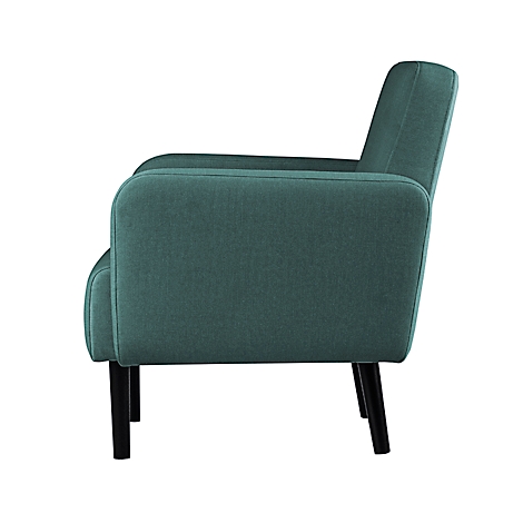 Blauwgroene fauteuil, zijaanzicht. Zwarte poten, stoffen textuur.
