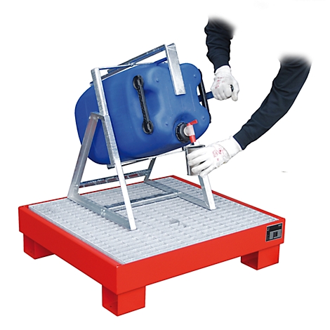 Blue canister on a red drip pan, operated by a person with gloves.