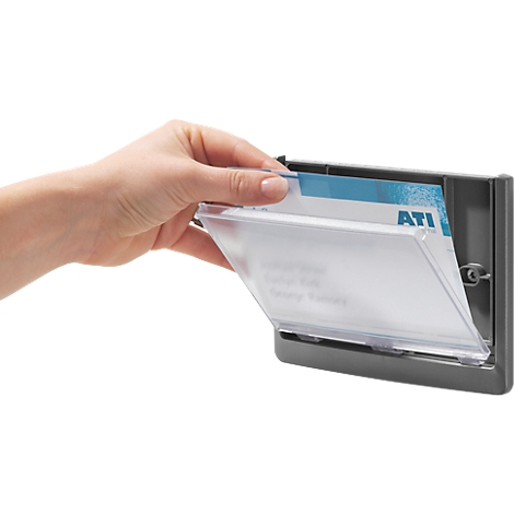 A hand opens a gray business card box to take out the cards.