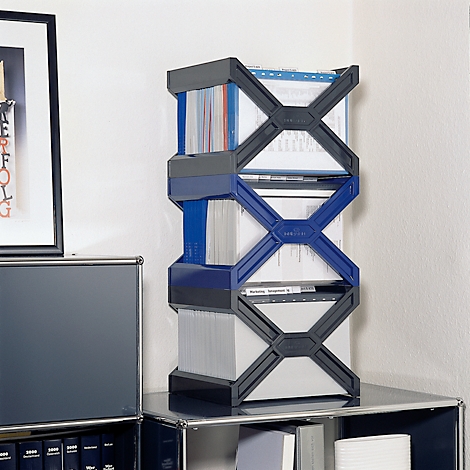 A shelf with file folders. The shelf is blue and gray. The picture shows the shelf in an office.