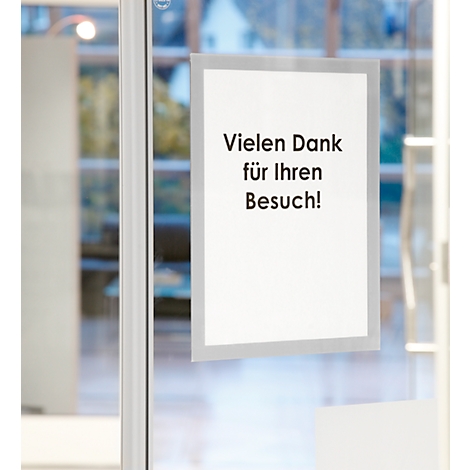 A sign saying "Thank you for your visit!" is hanging on a glass door.