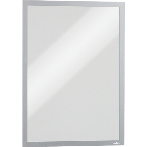 Rectangular mirror with a narrow, silver-colored frame hanging against a white wall.